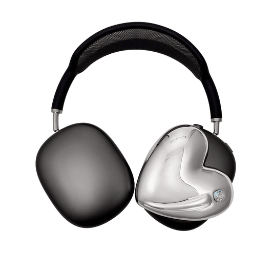 Metallic heart-shaped AirPods Max cover in silver, pink, red and black, with a smooth 3D sculpted surface and a single crystal stud detail.