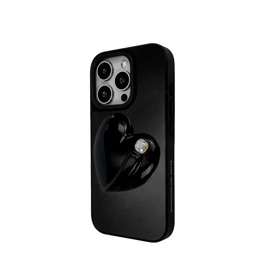 Metallic silver, pink, red, black iPhone case with a large sculpted heart in 3D, featuring a shiny chrome finish and a single gem-like detail.