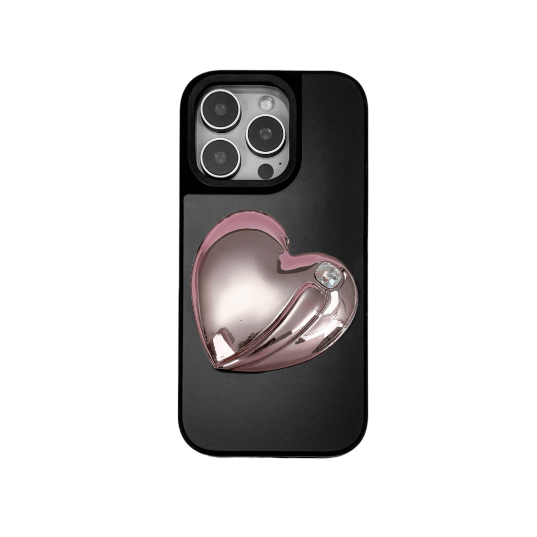 Metallic silver, pink, red, black iPhone case with a large sculpted heart in 3D, featuring a shiny chrome finish and a single gem-like detail.