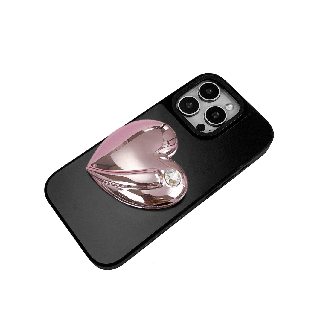 Metallic silver, pink, red, black iPhone case with a large sculpted heart in 3D, featuring a shiny chrome finish and a single gem-like detail.