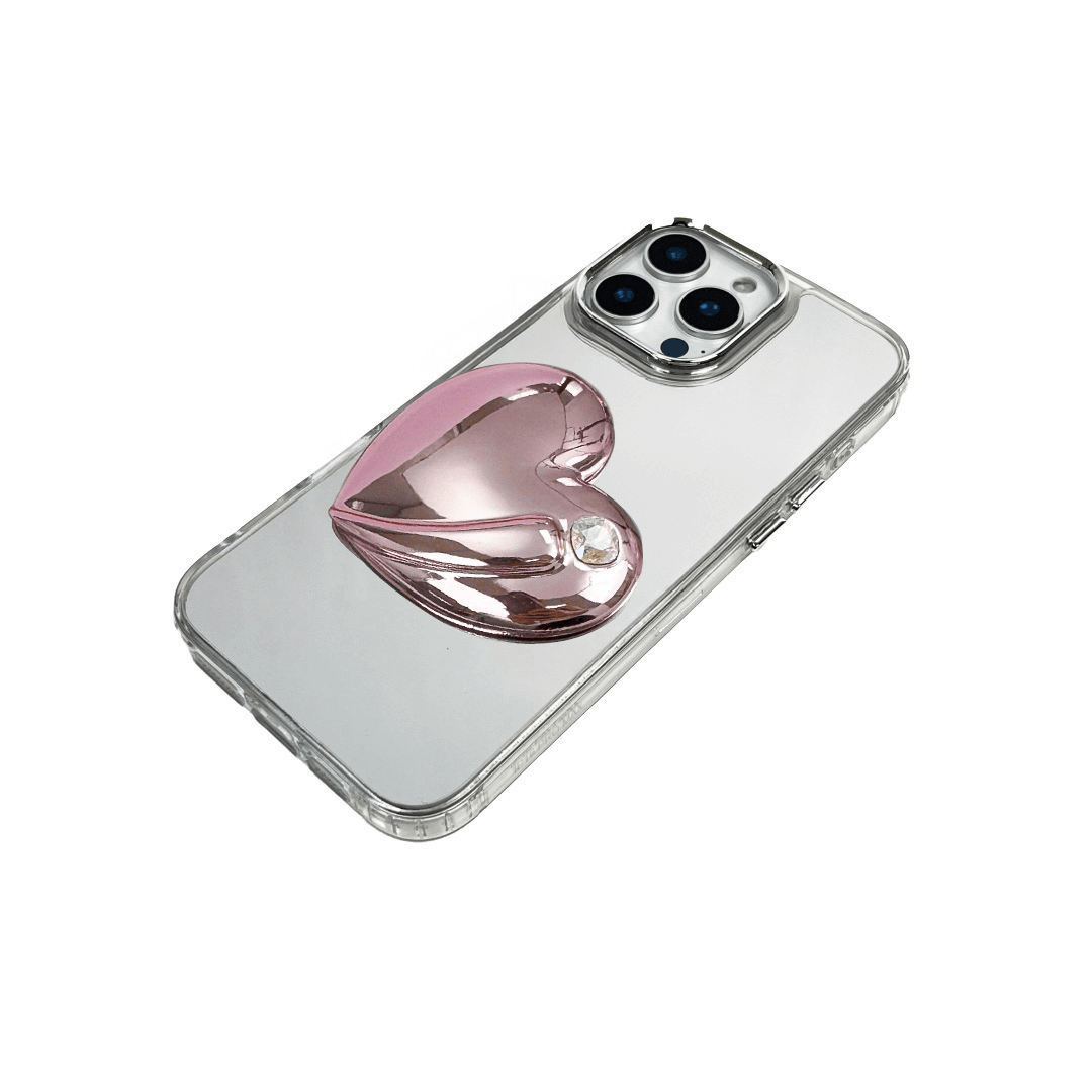 Metallic silver, pink, red, black iPhone case with a large sculpted heart in 3D, featuring a shiny chrome finish and a single gem-like detail.