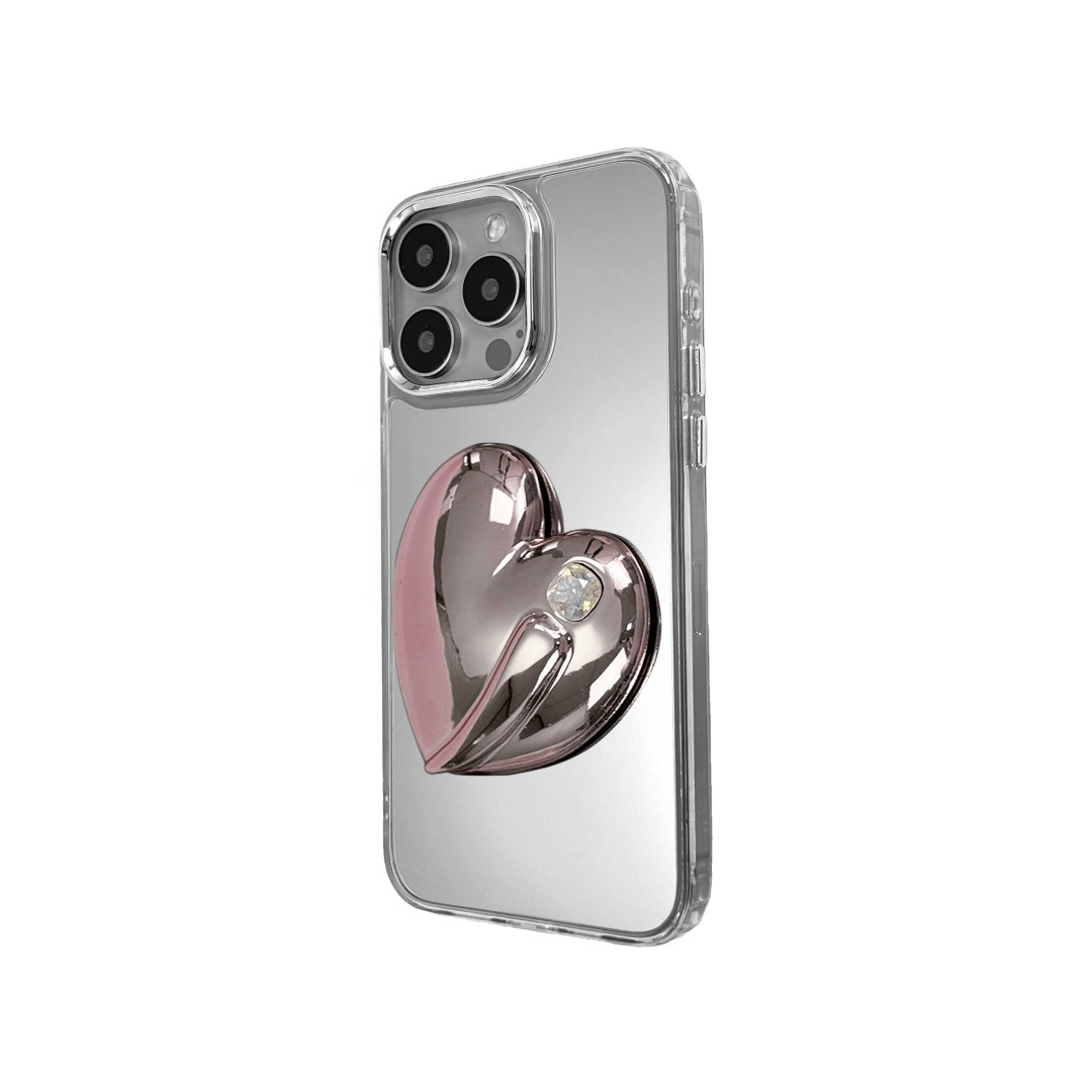 Metallic silver, pink, red, black iPhone case with a large sculpted heart in 3D, featuring a shiny chrome finish and a single gem-like detail.
