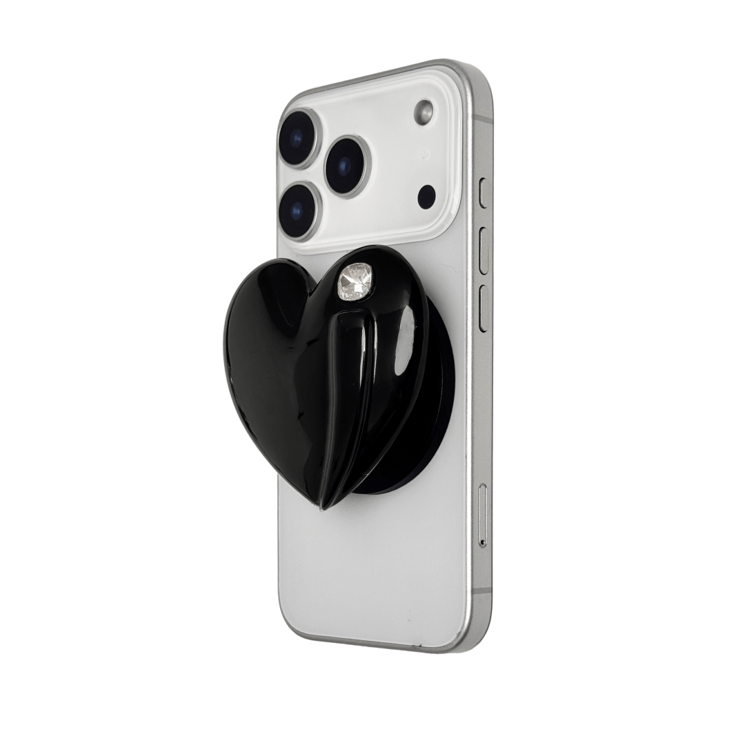Metallic silver, pink, red, black Phone grip with a large sculpted heart in 3D, featuring a shiny chrome finish and a single gem-like detail.