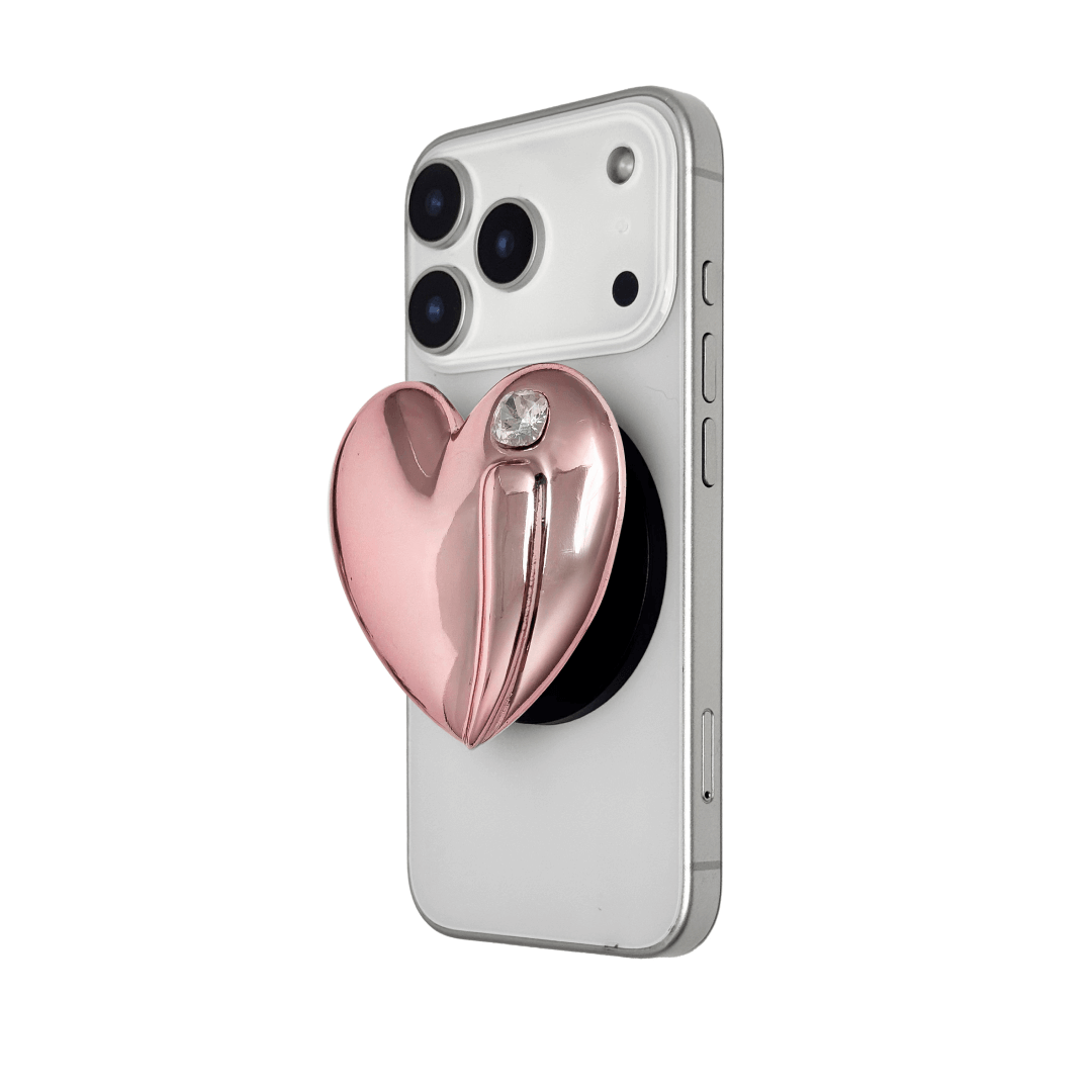 Metallic silver, pink, red, black Phone grip with a large sculpted heart in 3D, featuring a shiny chrome finish and a single gem-like detail.