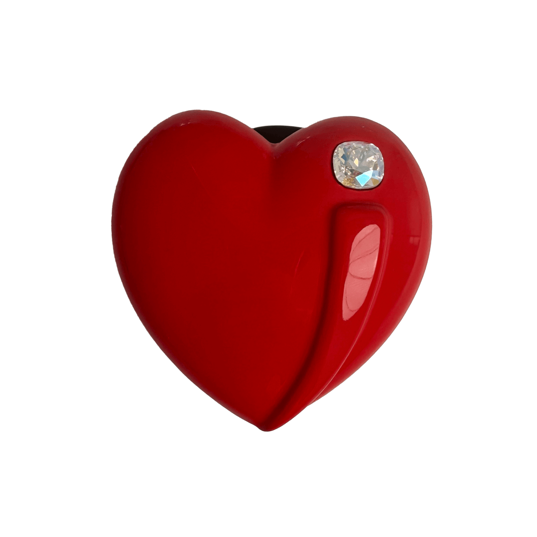 Metallic silver, pink, red, black Phone grip with a large sculpted heart in 3D, featuring a shiny chrome finish and a single gem-like detail.