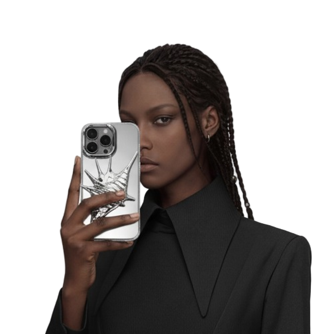 Woman holding a phone with a clear case against a plain background