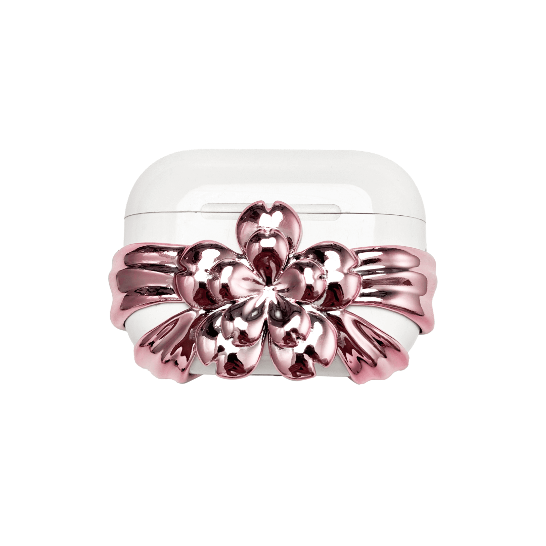 AirPods case cover decorated with a multi-petal cherry blossom in pink or silver, adding a soft and elegant floral accent to a sleek protective design.