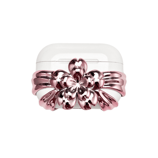 AirPods case cover decorated with a multi-petal cherry blossom in pink or silver, adding a soft and elegant floral accent to a sleek protective design.